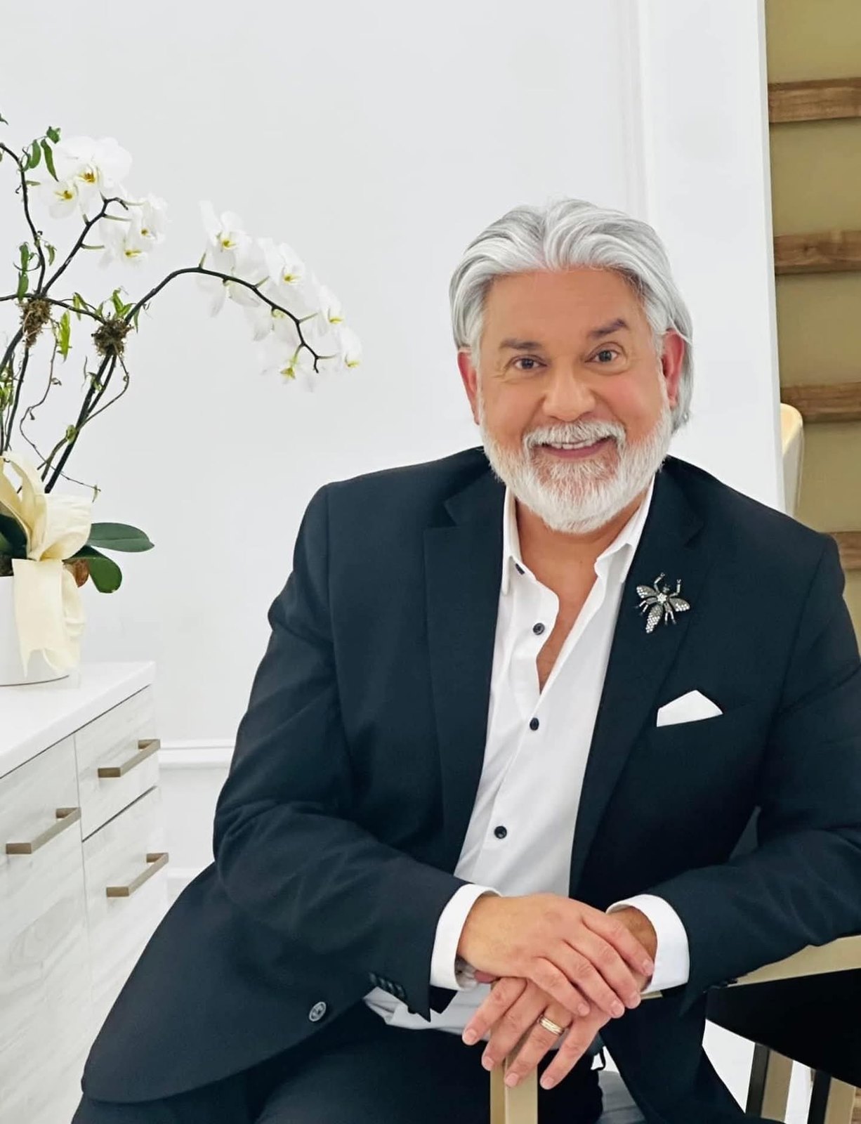 Charles May, master hairstylist in formal portrait